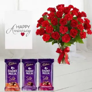 Vase arrangement of 20 red roses with red carnations,  set of 3  dairy milk silk  chocolates, anniversary greeting card 