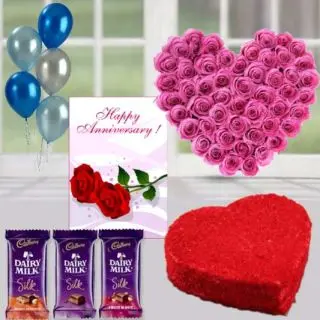 30 pink roses heart shape arrangement , heart shape red velvet cake, set of 3 dairy milk silk chocolates, anniversary greeting card, with 5 blown balloons