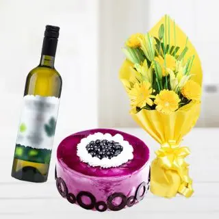 Bunch of yellow lilies&gerberas with bottle of white wine with blueberry cake