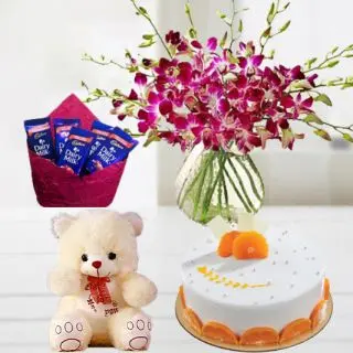 BEautiful Vase arrangement of 10 purple orchids with orange cool cake with 1 feet height teddybear with pack of dairy milk chocolates 