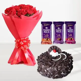 Bunch of 12 red carnations with chocolate fantasy fresh cream cake with 3 dairy milk silk chocolates 