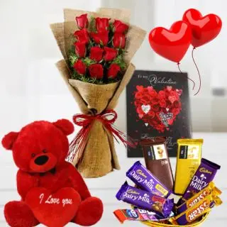 Bunch of 12 red rose sin jute packing, 1 feet height red teddybear, basket of assorted chocolates, valentine day card, pair of heart shape balloons