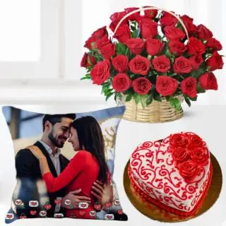 Basket of 25 red roses, 1 kg heart shape red velvet designer floral theme cake with photo cushion