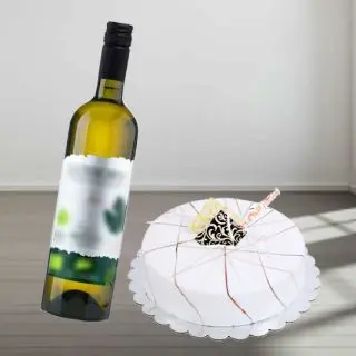vanilla fresh cream cake with bottle of white  wine 