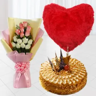 Bunch of 12 pink and white roses, half kg premium quality butterscotch cake, with red heart shape cushion