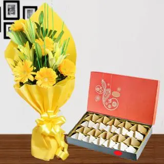 Bunch of yellow mix flowers with box of 1 kg kaju katli