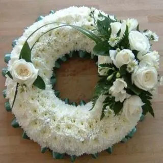 exclusive wreath of crysanthemum flowers with white rose arranged on it 
