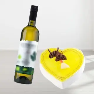 pineapple heart shape cake with bottle of white wine