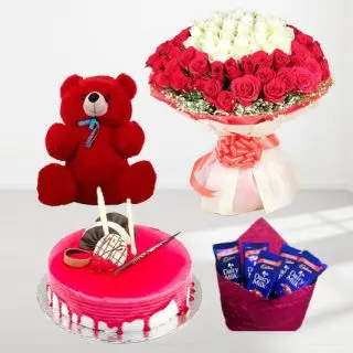Big and beautiful Bouquet of 100 red and white roses , strawberry cake , 6 inch red teddybear with pack of 5 dairy milk chocolates 