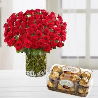 100 red roses arranged in glass vase with box of 16 pcs rocher ferrero chocolates 