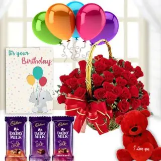 Basket of 25 red roses, 1 feet height red teddybear, 3 dairy milk silk chocolates, birthday Greeting card with 5 blown balloons 