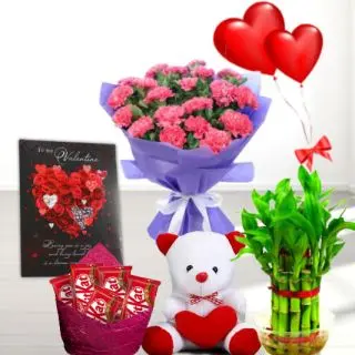 Bunch of 8 pink carnations, 6 inch teddybear,  Basket of 20 kit kat chocolates,  2 layer Lucky bamboo plant ,5 blown balloons with greeting card