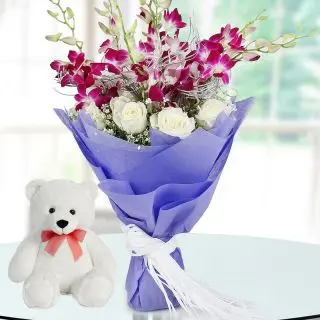 Bunch of lavender orchids with 1 feet height white teddy bear