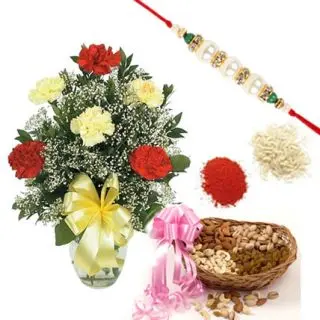 10 mix colour carnations in glass vase with 1 kg assorted dry fruits with 1 rakhi and roli chawa
