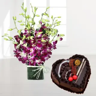 10 purple orchids in glass vase with heart shape chocolate cake 