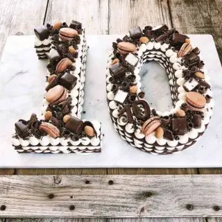 10 shape numeric theme cake with chocolates ,macrons topping in 4 kg 