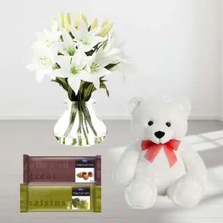  Beautiful Arrangement of 5 fresh white lilies in glass vase with 6 inch teddy bear & set of 2 temptations chocolate