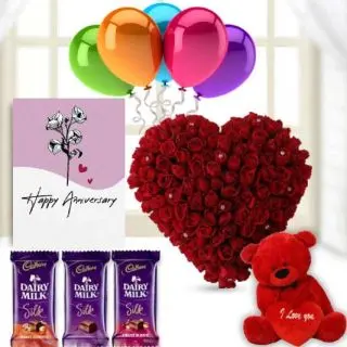 Heart shape arrangement of 50 red roses, 1 feet height red teddybear, 3 dairy milk silk chocolates, anniversary  Greeting card with 5 mix blown balloon 