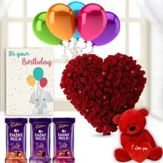 Heart shape arrangement of 50 red roses, 1 feet height red teddy bear, 3 dairy milk silk chocolates,birthday  Greeting card with 5 blown balloon 