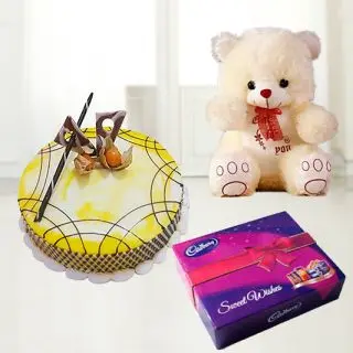 pineapple fresh cream premium quality cake with box of celebration chocolates with 1 feet height teddy bear