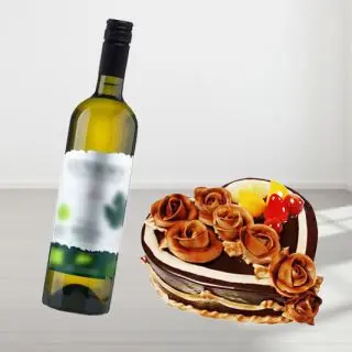 heart shape chocolate cake with exotic fruits topping with bottle of white wine