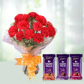 Bunch of 12 red carnations with 3 dairy milk silk chocolates 