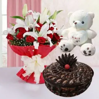 Beautiful looking bunch of white lilies arrangment with red roses with double chocolate cake with 6 inch teddy bear