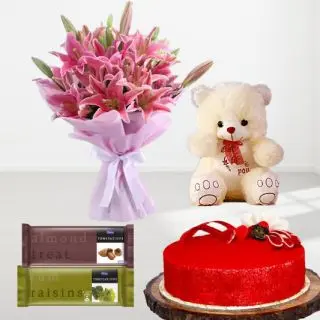 beautiful hand bouquet of 10 pink lilies with 1 feet height teddybear with red velvet cake with pair of 2 temptations chocolates