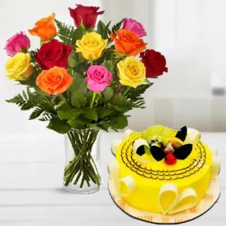 12 mix roses arranged in glass vase with half kg designer pineapple cool cake 