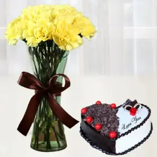 12 yellow carnations in glass vase with heart shape black forest cool cake 