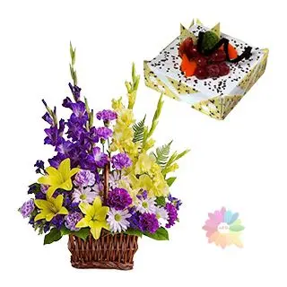 Basket of Exotic mix flowers with pineapple cake with fresh fruits topping 