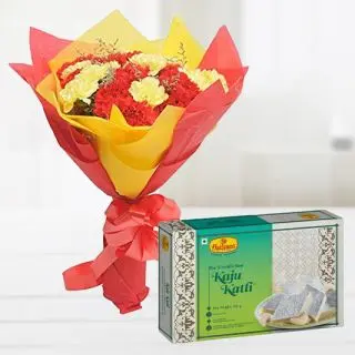 Bunch of 20 red and yellow carnations with box of 1 kg kaju katli