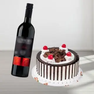 choco vanilla cake with bottle of red wine 