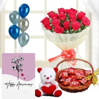 Bunch of 12 red roses, basket of 30 kitkat chocolates, 6 inch white teddybear, anniversary  Greeting card with 5 blown balloons 