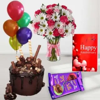 Vase arrangement of Exotic mix flowers, chocolate explosion cake, set of 2 dairy milk silk, anniversary greeting card, with 5 blown balloons