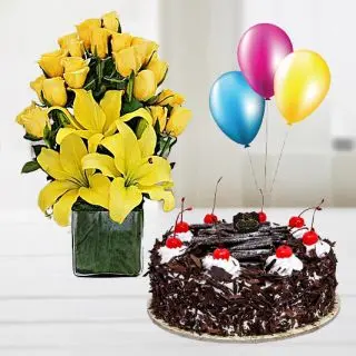 Basket arrangement of lilies and roses with chocolate fantasy cake with 3 blown balloons