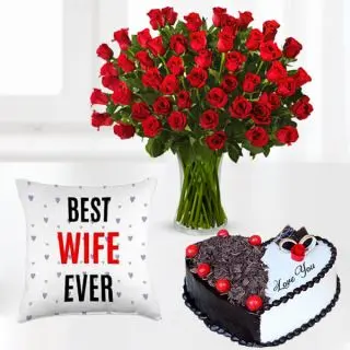 50 red roses in glass vase with Half kg heart shape black forest cool cake with photo cushion 