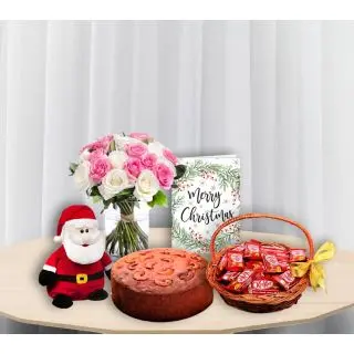 15 pink and white roses in glass vase, plum cake, greeting card , basket of kitkat chocolates with santa soft toy