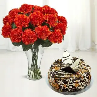 15 red carnations arranged in glass vase with dryfruit cool cake 