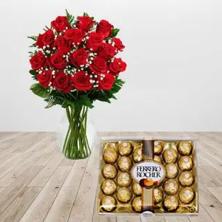 15 red roses arranged in glass vase with box of 24 pcs rocher ferrero chocolates 