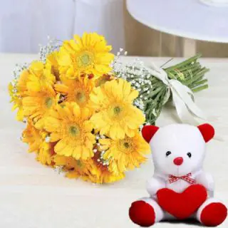 Hand bouquet of yellow gerberas with 6 inch white teddy bear