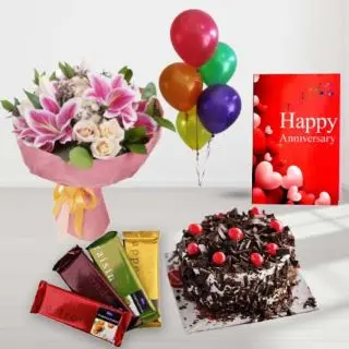 Bunch of Exotic Mix flowers, black forest cake, pack of 4 temptations chocolates , anniversary greeting card, with 5 blown balloons