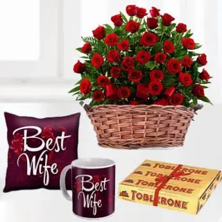 Basket of 50 red roses , 3 toblerone chocolates, set of photo cushion with photo mug 