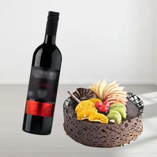 mix fruit cake with bottle of red wine 