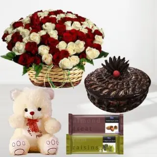 basket arrangement of 100 red and white roses, 1 feet height teddybear, chocolate fudge cake with pair of temptations chocolates 