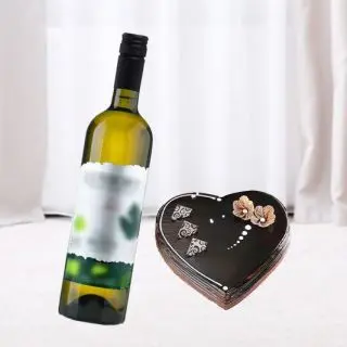 chocolate truffle heart shape rich quality cake with bottle of white  wine