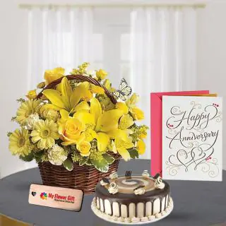 Beautiful Basket Arrangement of yellow mix flowers with half kg coffee cake with anniversary card