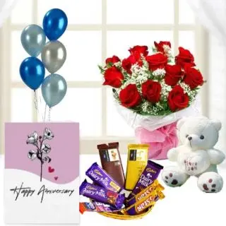 Bunch of 10 red roses,  1 feet height teddybear, Basket of assorted chocolates , anniversary Greeting card with 5 blown balloons