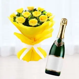 Bunch of 12 yellow roses with bottle of champegne