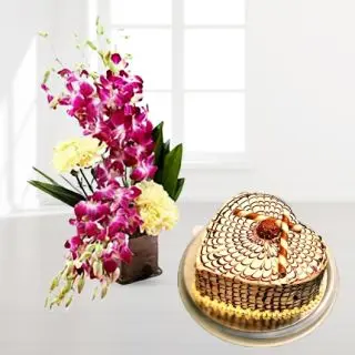 1 feet height arrangement of orchids with carnations and butterscotch cool cake 
